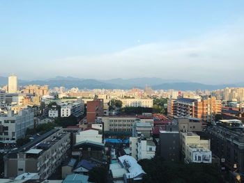 High angle view of buildings in city against sky