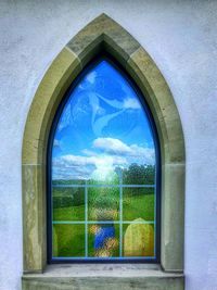 Blue sky seen through window of building