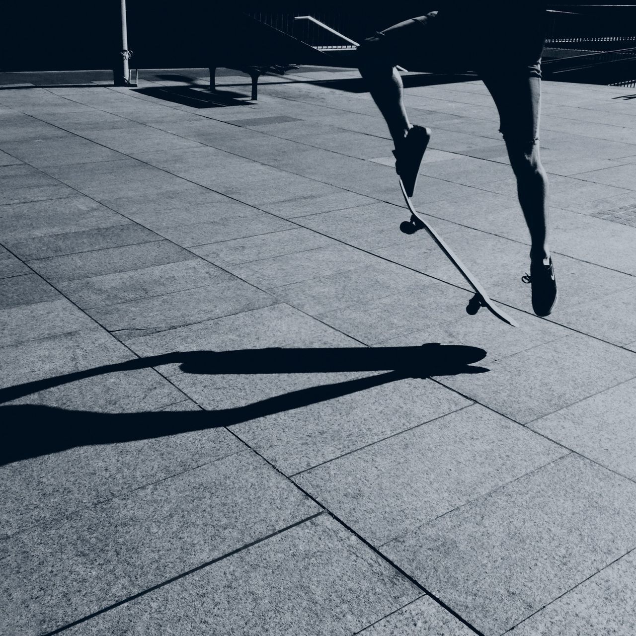 walking, lifestyles, men, low section, person, leisure activity, street, shadow, city life, sunlight, sidewalk, standing, paving stone, silhouette, full length, tiled floor, unrecognizable person