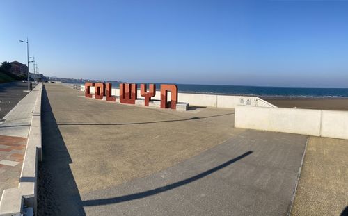 Scenic view of beach against clear sky