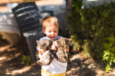 Full length of boy holding outdoors