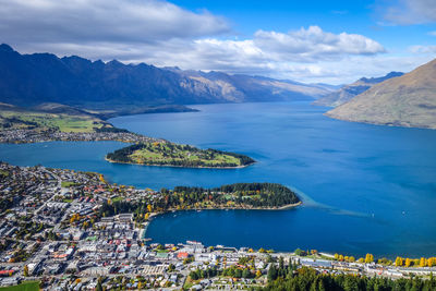 Aerial view of lake and mountains against sky