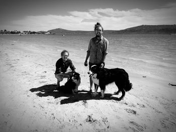 People with dog on beach