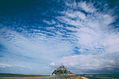 Building against cloudy sky