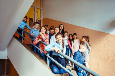 High angle view of people standing on staircase