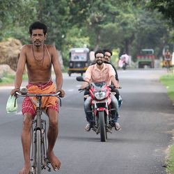 Portrait of smiling man riding bicycle