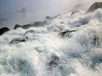 Waves splashing on rocks