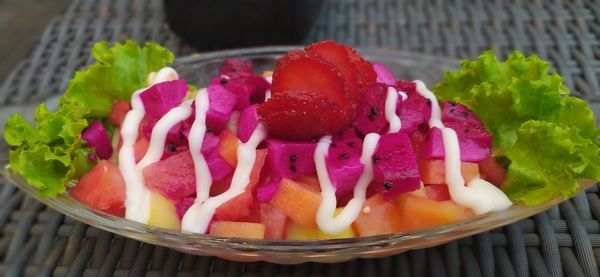 High angle view of chopped fruits in bowl on table