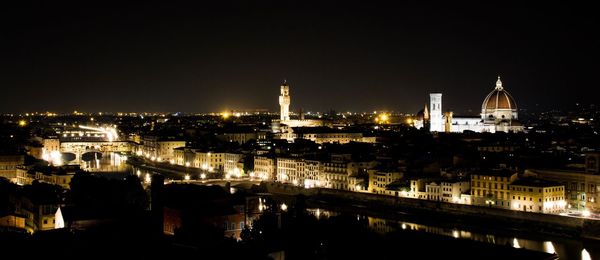 Illuminated buildings in city at night