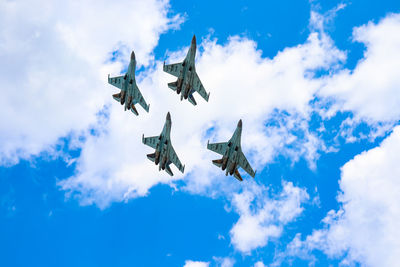 Low angle view of airplane flying in sky