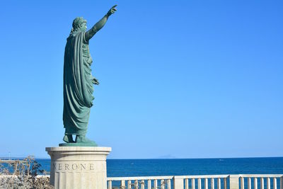 Statue of liberty against blue sky