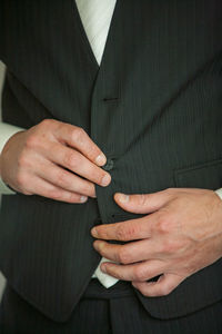 Detailed shot of businessman getting ready