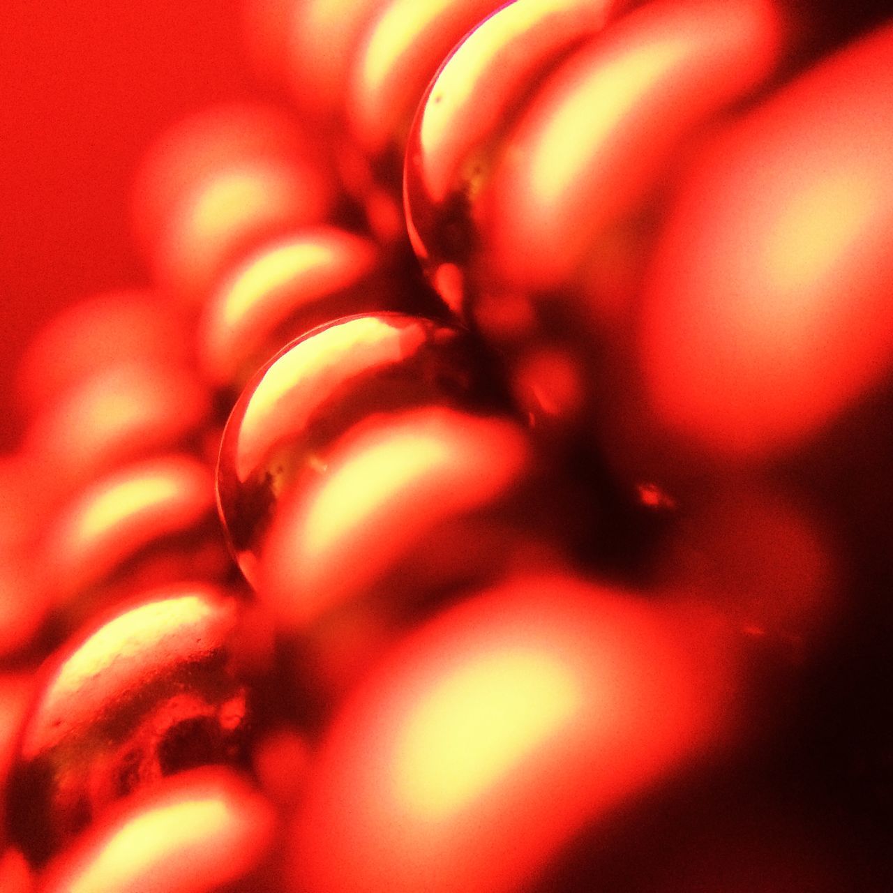 full frame, backgrounds, red, close-up, selective focus, indoors, pattern, abstract, detail, circle, no people, shiny, still life, textured, large group of objects, glowing, defocused, shape, orange color, extreme close-up