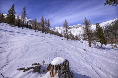 Panoramic view of snow covered mountain against sky