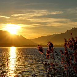 Scenic view of lake against sky during sunset