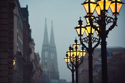 Illuminated city against sky