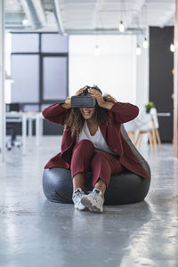 Woman sitting on floor