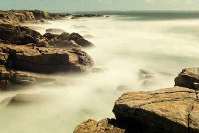 Scenic view of rocks in sea