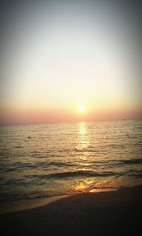 Scenic view of sea against clear sky during sunset