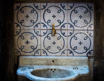 Close-up of faucet in bathroom at home