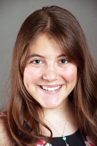 Close-up portrait of smiling young woman