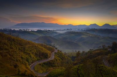 Scenic view of landscape against sky during sunset