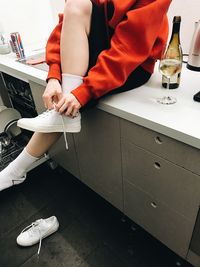 Low section of man sitting on floor