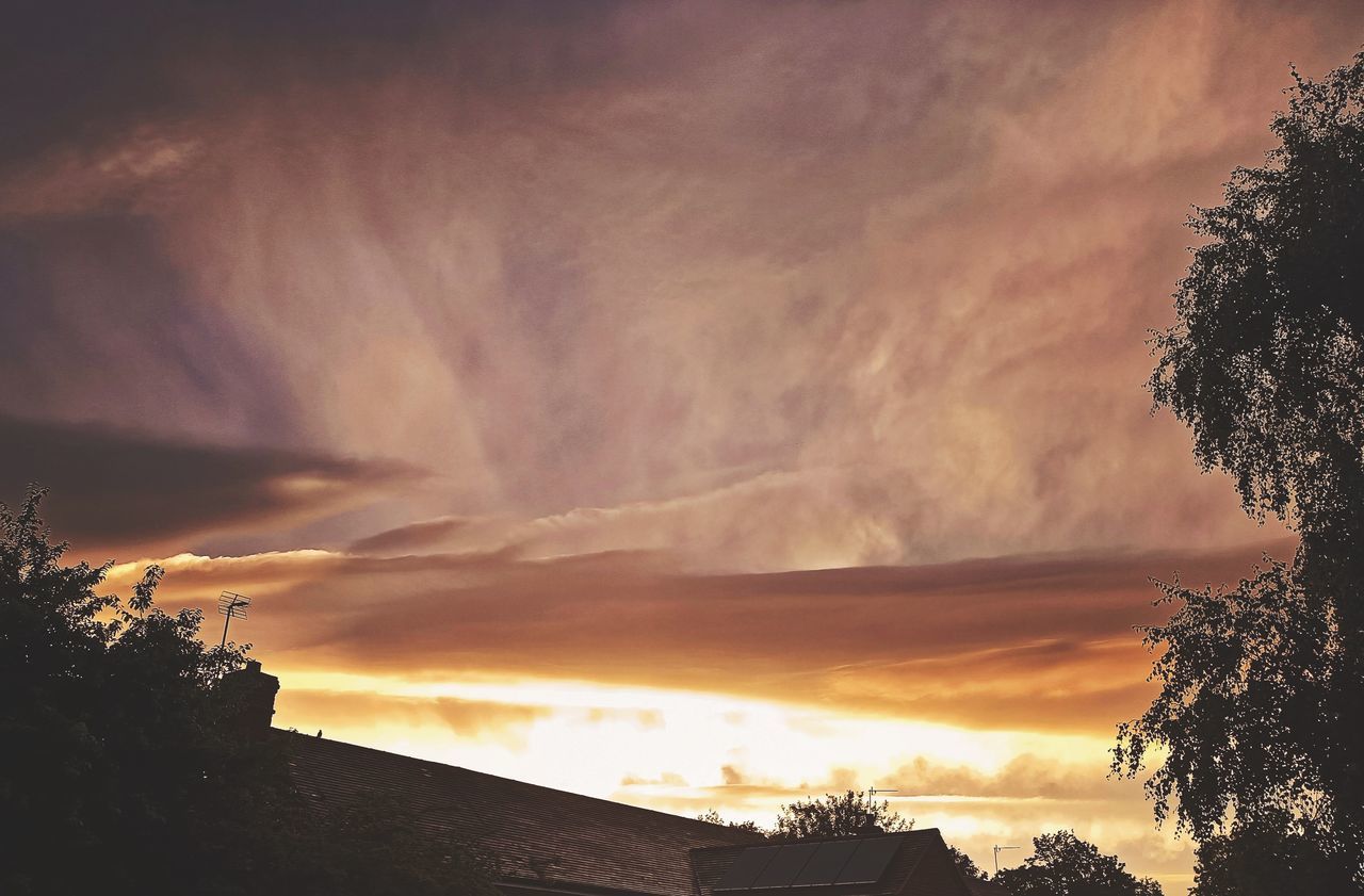 sky, cloud, tree, sunset, beauty in nature, nature, plant, dramatic sky, no people, silhouette, scenics - nature, environment, sunlight, dawn, evening, architecture, outdoors, tranquility, orange color, landscape, cloudscape, storm, darkness