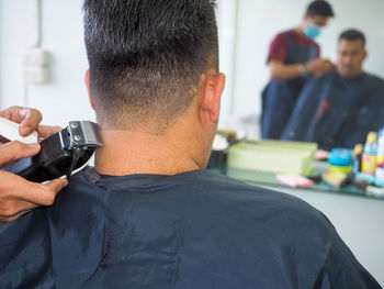 Hairdresser hairstyling male customer