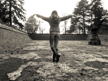 Woman standing on tree