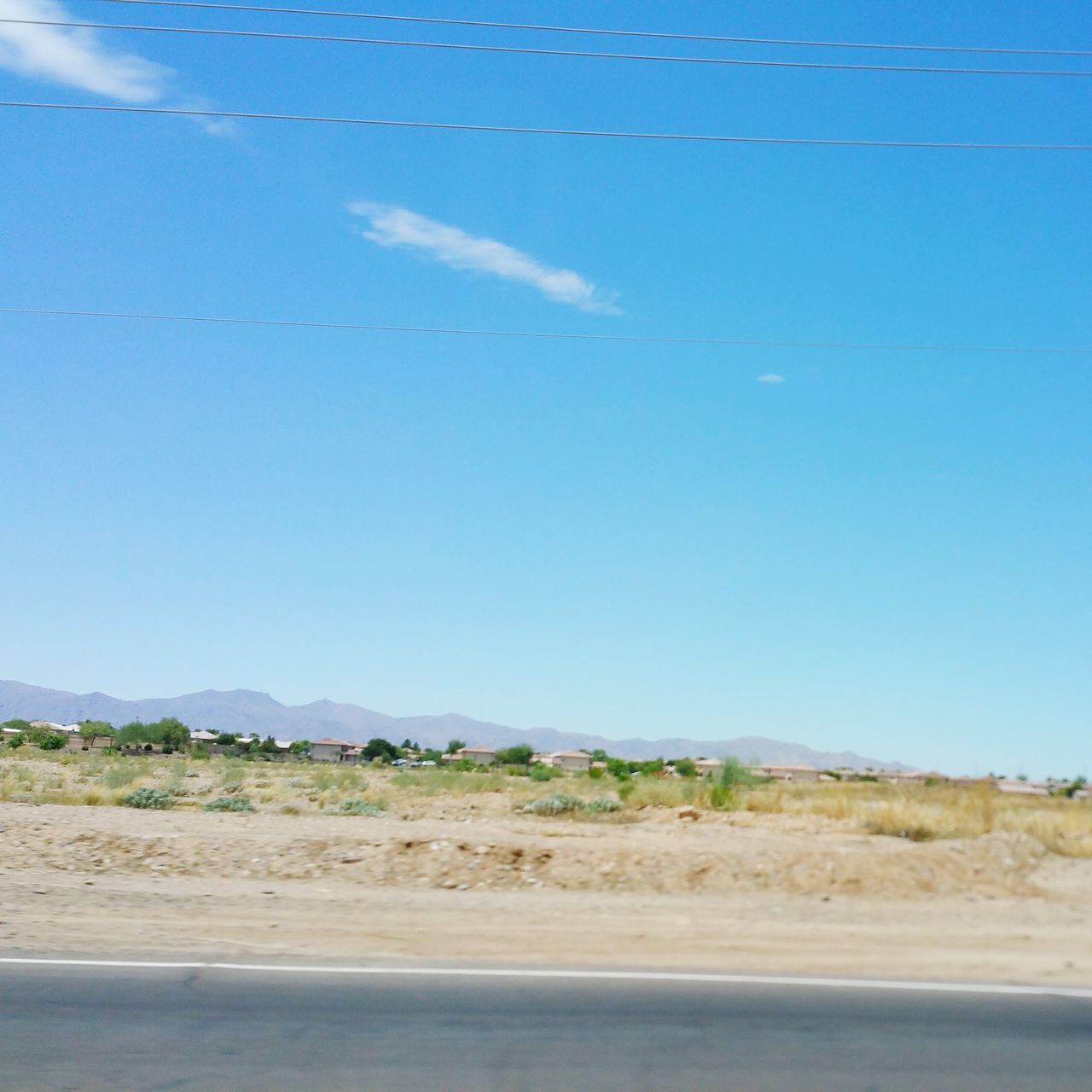 flying, blue, landscape, transportation, bird, mountain, clear sky, animal themes, tranquility, tranquil scene, sky, nature, scenics, road, beauty in nature, mid-air, copy space, day, wildlife