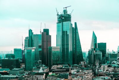 Modern buildings in city against sky