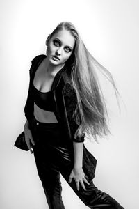 Portrait of a beautiful young woman over white background
