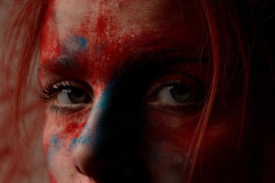 Close-up portrait of teenage girl with face paint 