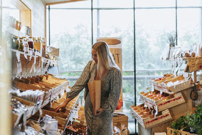 Woman doing shopping in eco shop