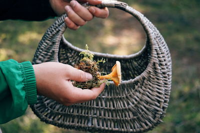 Midsection of person holding stick