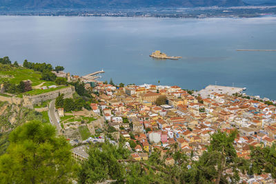 High angle view of townscape by sea