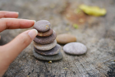 Close-up of person holding stones