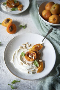 Caramelized apricots with cream cheese and pine nuts