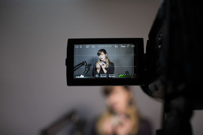 Portrait of woman photographing