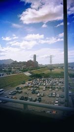 Cityscape against cloudy sky