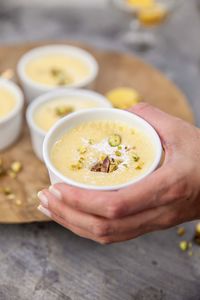 Close-up of hand holding bowl