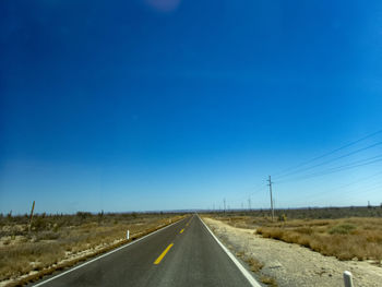 A long straight open road in the deserts of baja california, mexico