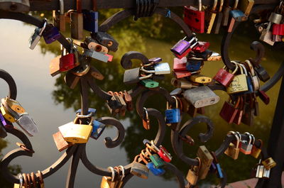 Close-up of padlocks hanging on railing