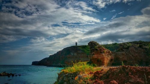 Scenic view of sea against cloudy sky