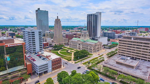 Buildings in city against sky