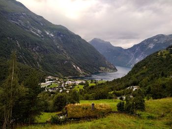 Scenic view of landscape and mountains against sky