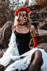 Closeup portrait of calavera catrina. young woman with sugar skull makeup and white spiderweb. dia