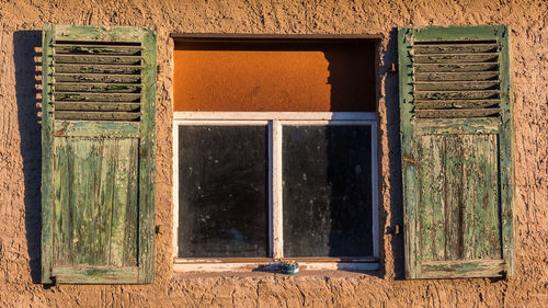 Full ashtray on the old window sill