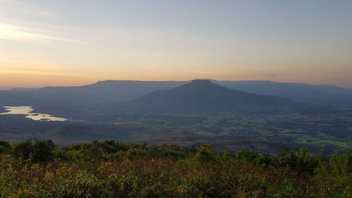 Scenic view of landscape against sky during sunset